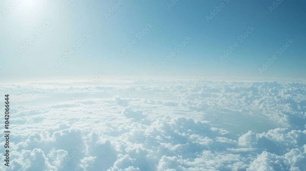 Poster the sun shines on fluffy clouds from an airplane window, creating a serene view. blue sky above give