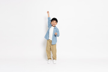 Happy Asian little boy hands up raised arms from happiness isolated on white background, Excited kid winner success concept, Looking at camera and full body composition