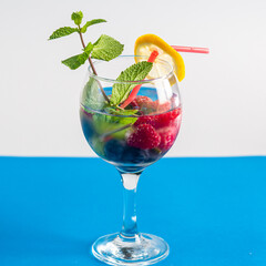 cocktail berry raspberry blueberry lemon and mint in a glass
