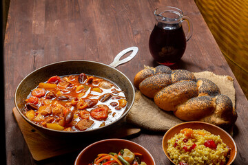 Chellent, tzimmes and bulgur on the festive table for the meal on Rosh Hashanah