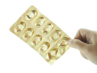 Female hand holding tablets that have been taken isolated on transparent background.