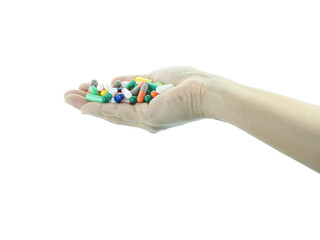 Female hand holding capsule medicine isolated on transparent background.