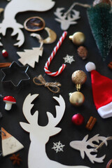 Various Christmas decorations in neutral colors on dark background. Selective focus.