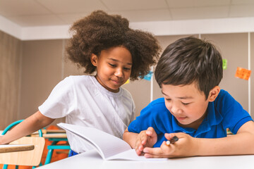 Multiethnic young kids students at elementary school in the class 