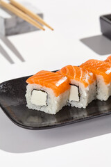 Fresh Salmon Philadelphia Roll Sushi in Minimalist Style with Natural Lighting and High Contrast
