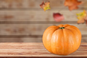 Autumn fresh ripe pumpkins on wooden table.