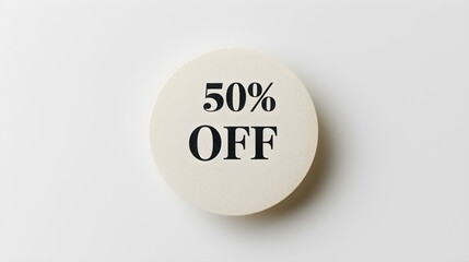 Black '50% OFF' Text on a Ivory Round Paper Note. White Background with Copy Space