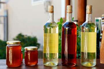homemade local greek products on sales counter, Honey and wine are a popular holiday souvenir