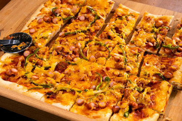 Pizza with hot dogs, cheese and vegetables. Food concept