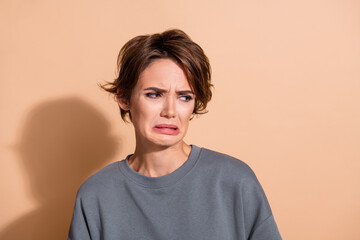 Photo portrait of attractive young woman look disgusted empty space dressed stylish gray clothes...
