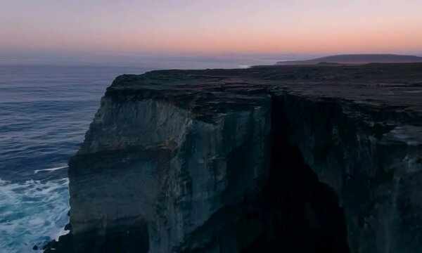 Dolly shot with soft, twilight hues: The camera starts with a close-up of a subduction trench. It then dolly&rsquo;s backward to reveal the trench and surrounding geological features with soft, twilight hue
