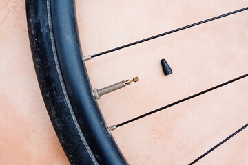Repairing a bicycle puncture with an inner tube on a sunny afternoon