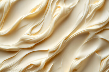Obraz premium creamy, textured substance is swirled and spread across a smooth surface