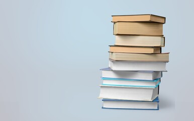 stack of old reading books on background