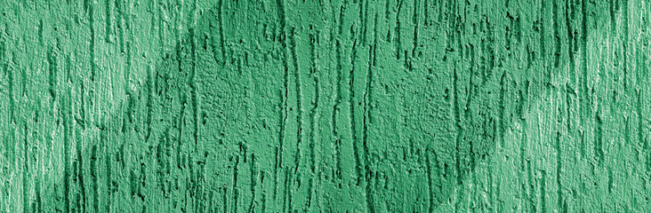 Abstract pastel green dynamic background. Texture of decorative plaster. Imitation of furrows after...