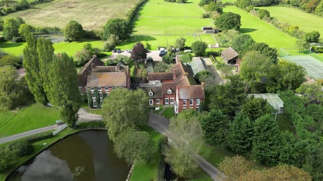 luxurious country house mansion england architecture grounds highlight elegance real estate outward outwards aerial drone shot luxury property uk scenic view investment unique 