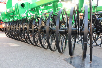 This is a HeavyDuty Agricultural Tiller that features Rotating Discs for efficient use