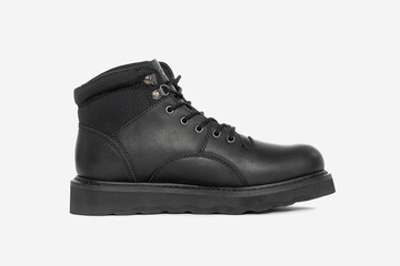 Black leather boots isolated on white background. Classic fashion footwear for everyday, hiking, outdoor activities, autumn and winter seasons.