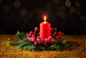 Red Christmas candle on a dark background