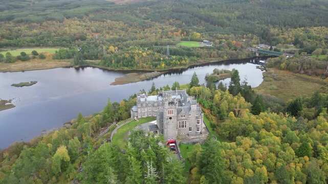 carbisdale castle above river valley scotland's highlands beautifully castle's architecture circling drone aerial forest kyle sutherland background scenic nature landscape exploration 