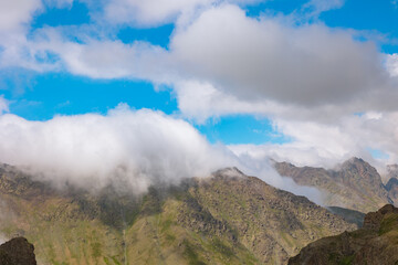 Misty mountain ranges. Landscape of a mountain range with clouds