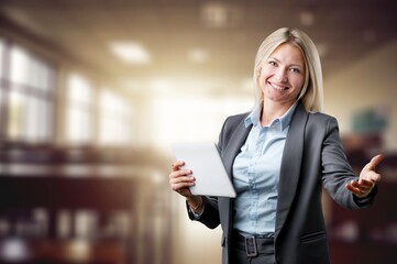 Fototapeta premium Happy school teacher posing in the classroom