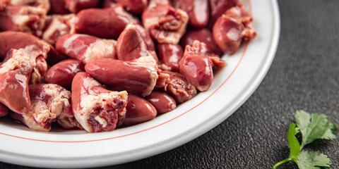 Chicken heart raw chicken offal tasty food dish Fresh delicious gourmet food background on the table rustic food top view copy space top view keto and paleo diet