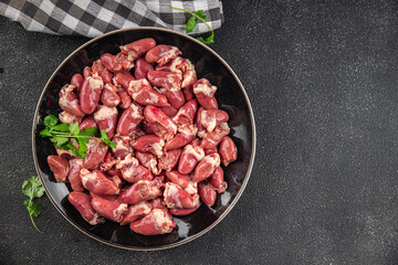 Chicken heart raw chicken offal tasty food dish Fresh delicious gourmet food background on the table rustic food top view copy space top view keto and paleo diet