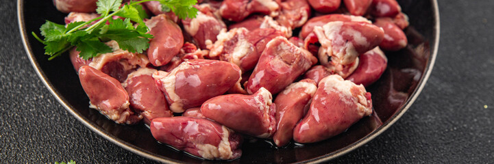 Chicken heart raw chicken offal tasty food dish Fresh delicious gourmet food background on the table rustic food top view copy space top view keto and paleo diet