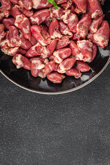 Chicken heart raw chicken offal tasty food dish Fresh delicious gourmet food background on the table rustic food top view copy space top view keto and paleo diet