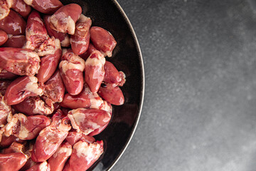 Chicken heart raw chicken offal tasty food dish Fresh delicious gourmet food background on the table rustic food top view copy space top view keto and paleo diet