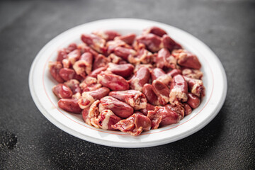 Chicken heart raw chicken offal tasty food dish Fresh delicious gourmet food background on the table rustic food top view copy space top view keto and paleo diet