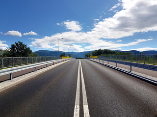 Asphalt road heading straight ahead