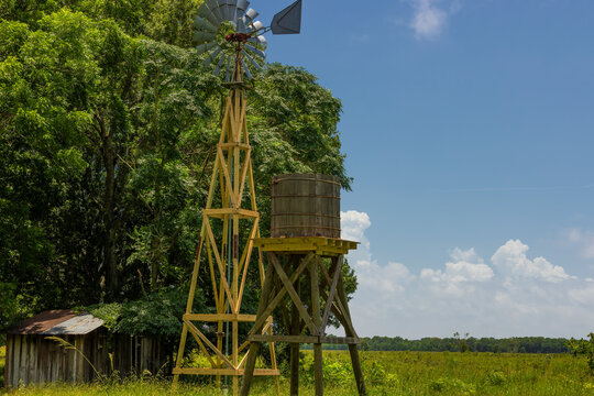 Agricultural landscape with windmill and Cistern at Armand Bayou Nature Park in Pasadena, Texas, USA