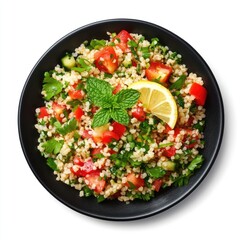 Fresh Tabbouleh Salad with Bulgur, Tomatoes, and Herbs Garnished with Lemon and Mint in a Black Bowl