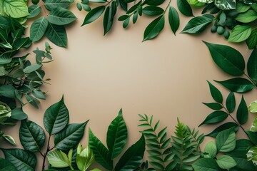 Naklejka premium A frame of green leaves on a beige background