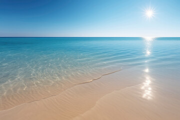 Obraz premium Serene landscape of light sea sand and crystal-clear blue water reflecting warm sunshine. Calm scene of harmony, relaxation and escape. For beach-themed design, travel project, wellness-related visual