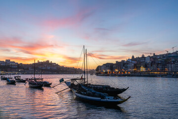 Porto City, Vila Nova de Gaia and Boats on Douro River at Sunset. Portugal