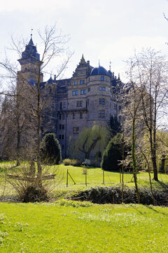 old, historic Neuenstein moated castle in the Neuenstein district of Oehringen in spring