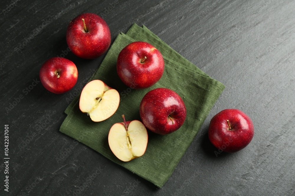 Canvas Prints Whole and cut ripe red apples on grey textured table, flat lay