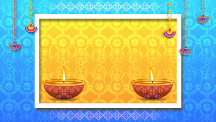 beautiful Diwali decoration with two burning oil lamp on yellow and blue gradient colour