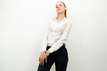 Obraz premium business woman smiling, looking at camera posing over white background with blank space. Studio portrait