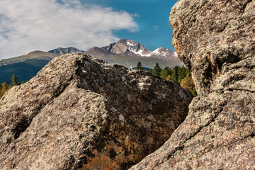 A broken boulder frames Longs Peak in the distance in Rocky Mountain National Park, Colorado
