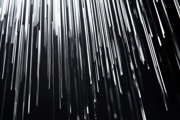 Abstract black background. Featuring a cascade of shimmering silver lines. Showcasing a sleek and sophisticated visual effect. Ideal for high-end graphics or luxury branding