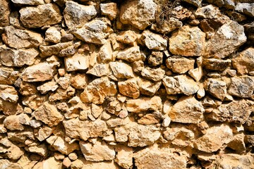 Old walls of the ancient fortress of Mycenae in Peloponnese, Greece. Mycenae was one of the largest fortresses in ancient Greece during the Bronze Age and played an important role in the Trojan War