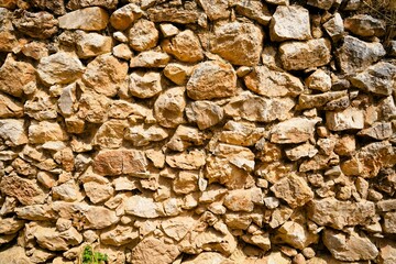 Old walls of the ancient fortress of Mycenae in Peloponnese, Greece. Mycenae was one of the largest fortresses in ancient Greece during the Bronze Age and played an important role in the Trojan War