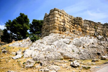 Remains of the fortification walls of Mycenae on Peloponnese in Greece. Mycenae was one of the largest citadels in Ancient Greece during the Bronze Age and played an important role in the Trojan War