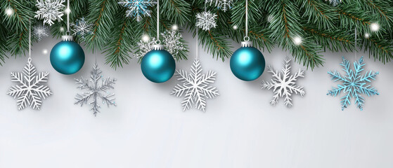 This festive image features teal ornaments and snowflakes hanging from green pine branches, set against a light background, evoking a winter holiday atmosphere.