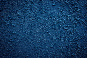 Obraz premium Dark blue textured wall with imperfections and uneven paint, low angle view