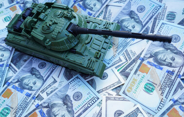 Tank on banknotes background. Currency war. War costs, military spending. Making money from war. Money laundering on War. Military economy. Military tank on American Dollars banknotes. Weapons trade.